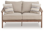 Beige loveseat with cushion, two striped throw pillows, centered seat cushions, wood frame