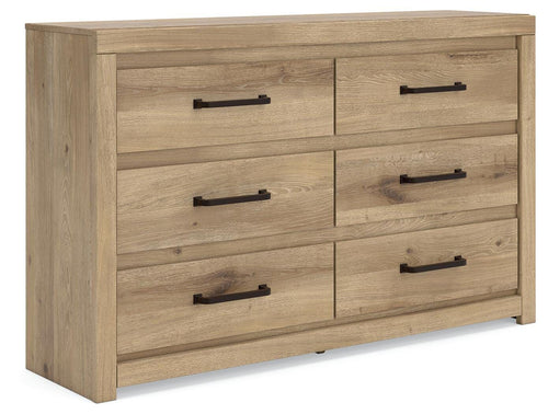 Light brown wooden dresser with six drawers and black bar pulls