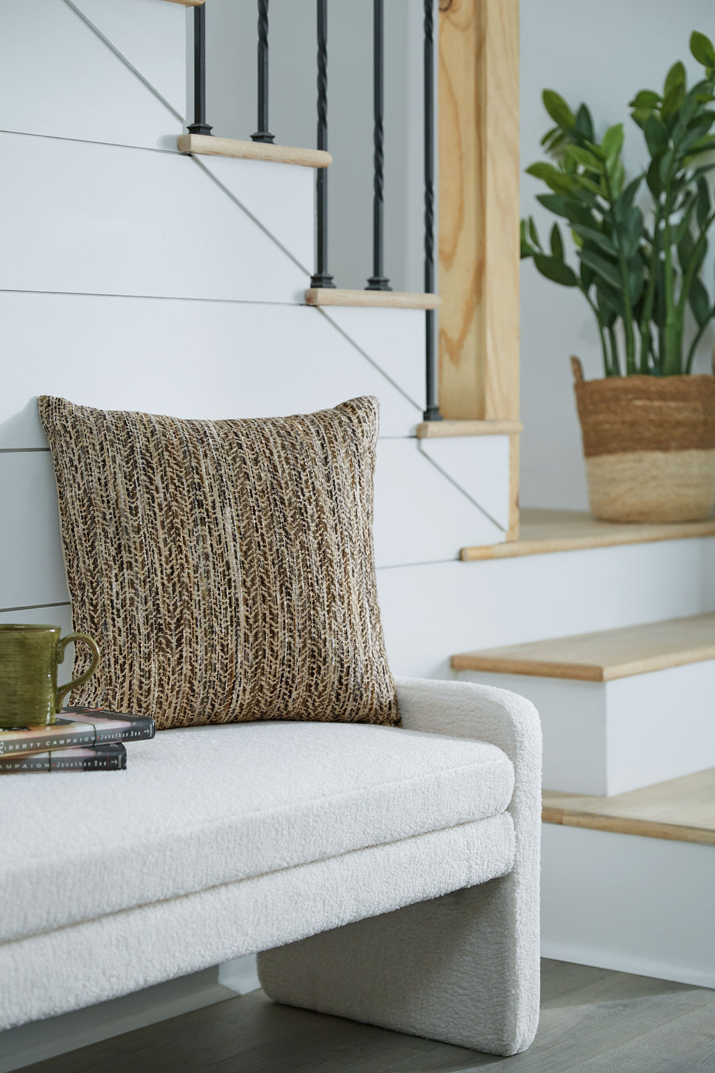 Textured dark brown and cream decorative pillow on a couch