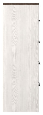 Four-drawer chest side panel in white wood with vertical grain texture.