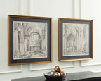 Two framed cathedral sketch prints with gold-tone frames, displayed on a wall