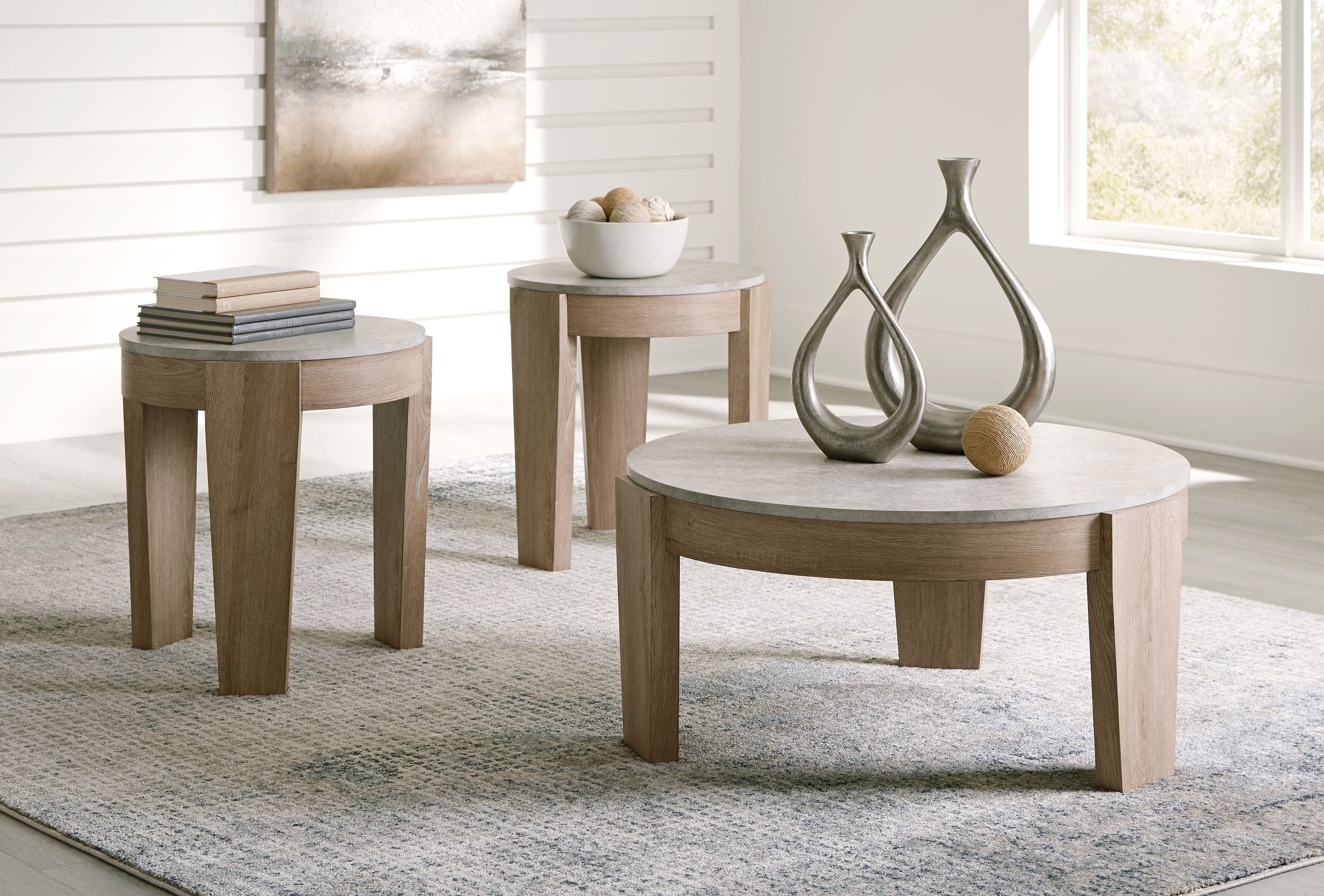 Round occasional table set of 3 with light brown legs and gray tabletops