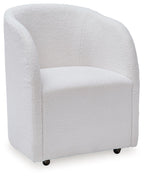 Ivory upholstered dining arm chair angled view with curved back and black feet