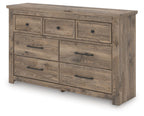 Light brown dresser with seven drawers and long bar pulls