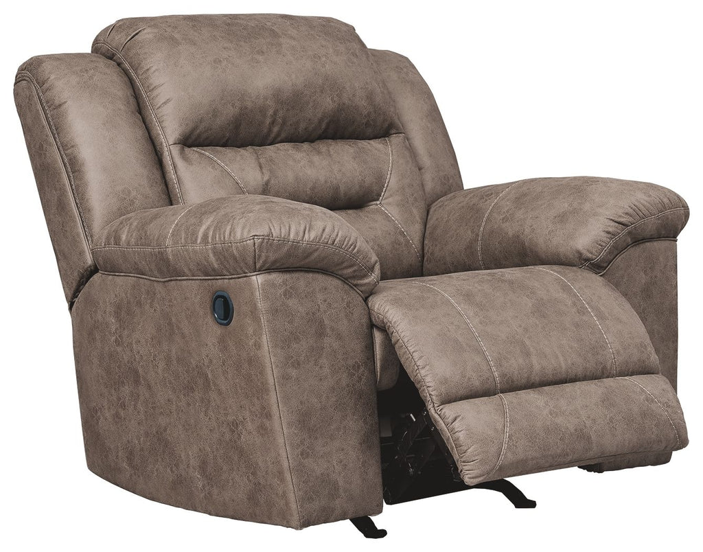 Taupe rocker recliner with tall back, winged arms, and curved footrest
