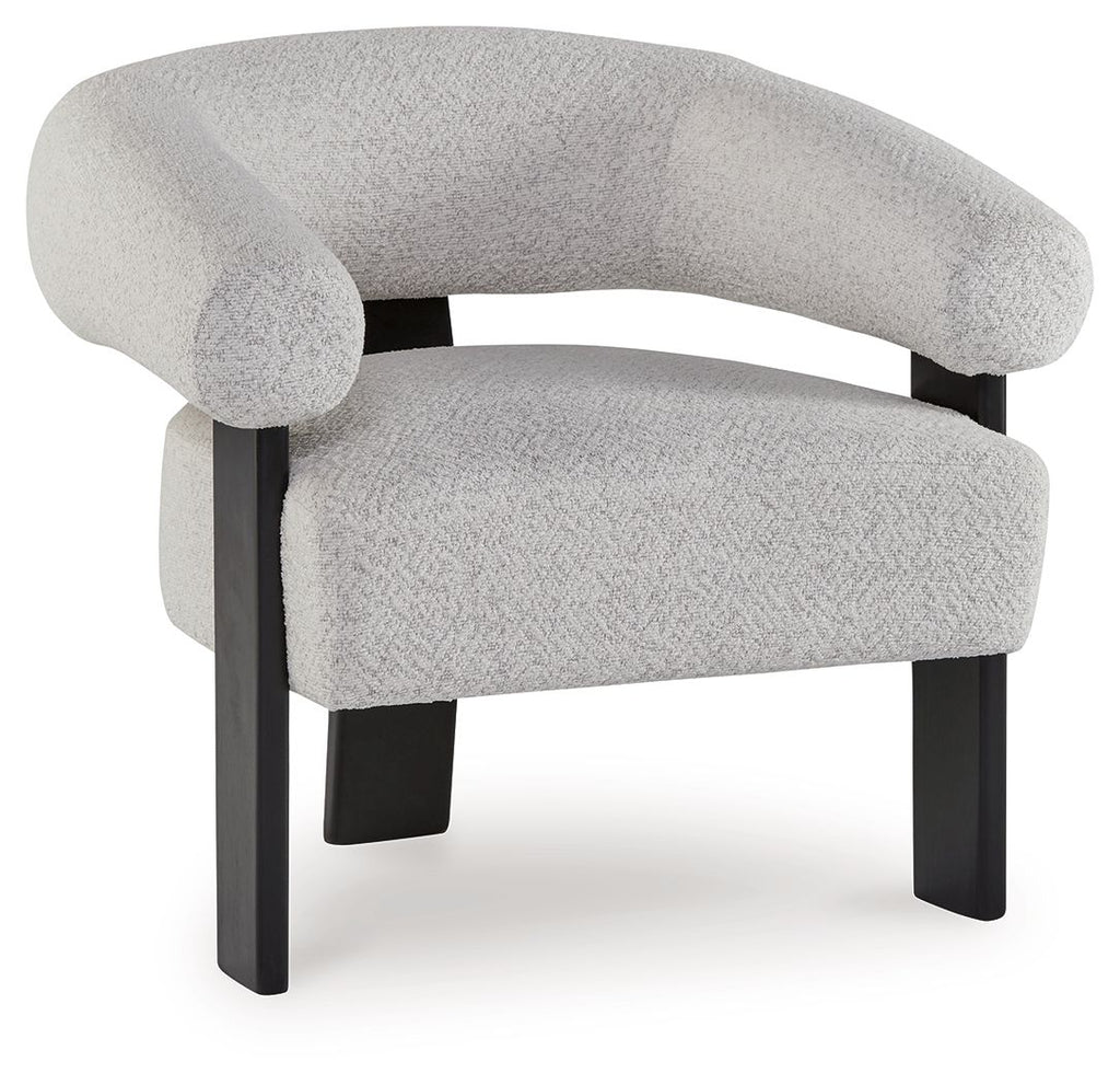 Light gray upholstered accent chair with curved armrests and dark wooden legs