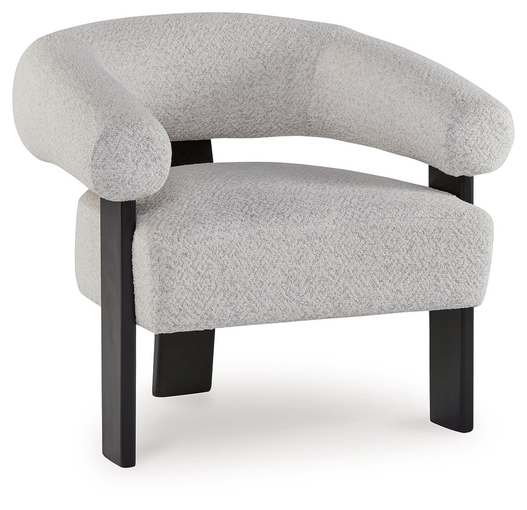 Light gray upholstered accent chair with curved armrests and dark wooden legs