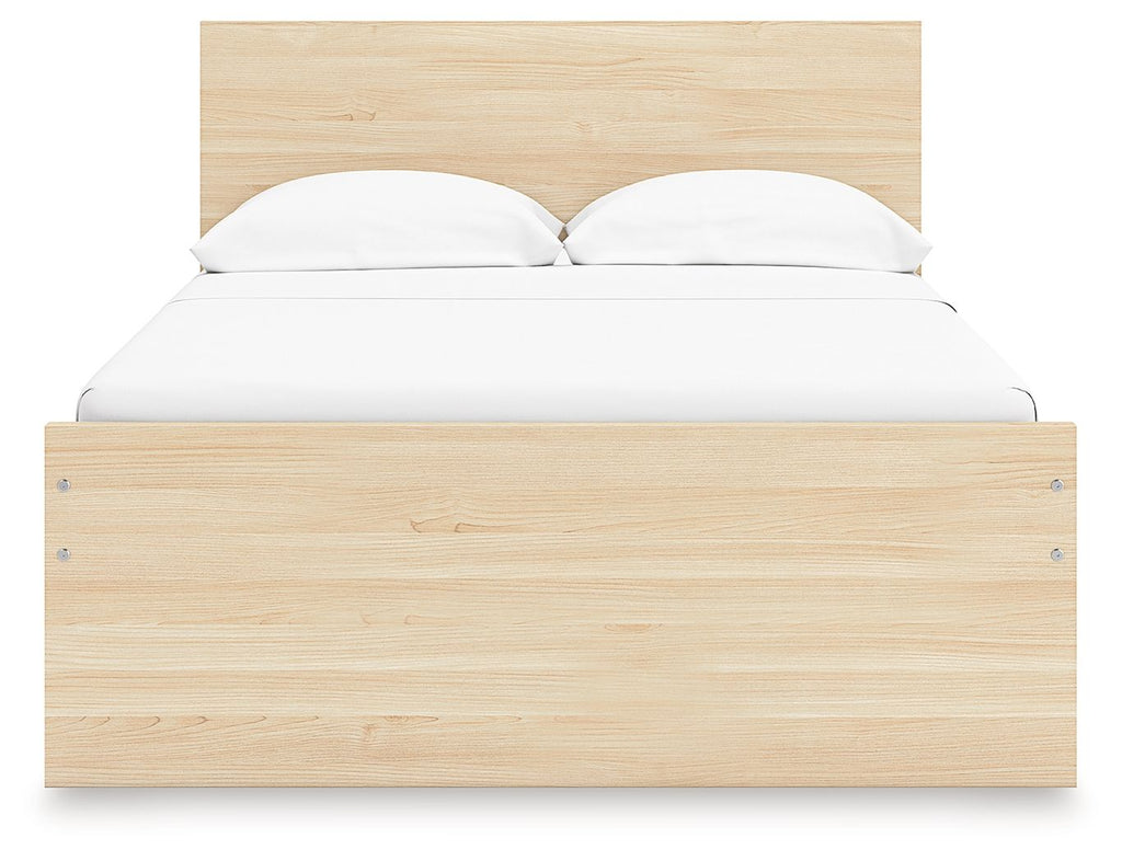 Light brown wood panel platform bed with two pillows on the headboard.