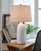 Ceramic table lamp with white base and beige drum shade