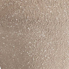 Beige textured metal surface detail with speckled finish