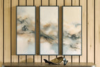 Three framed abstract cloud wall prints with dark borders, muted beige, gray, and brown tones