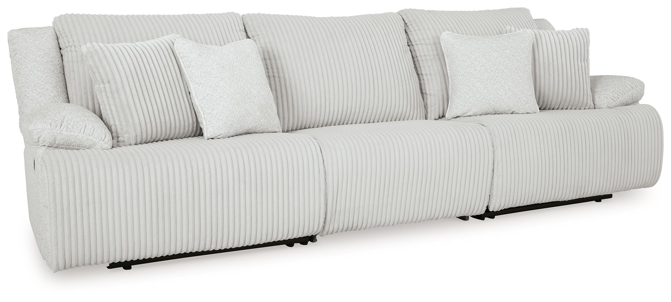 White ribbed reclining sectional sofa with chaise and stacked back pillows