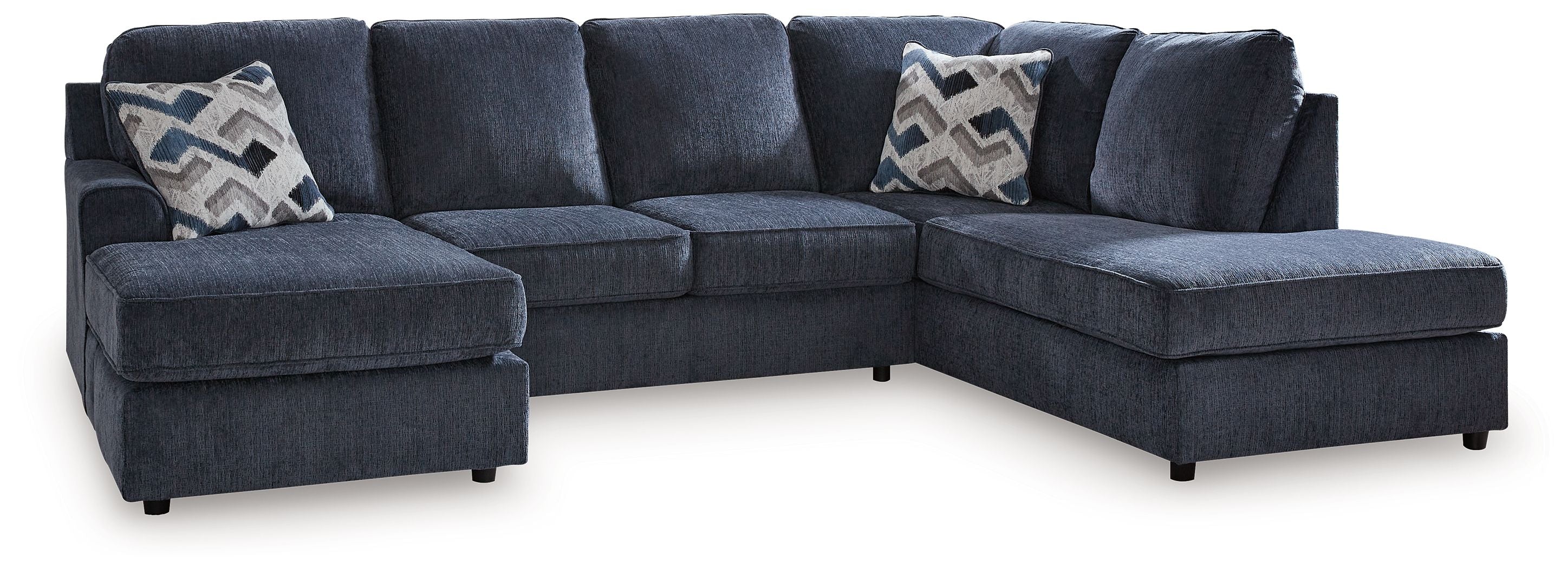 Cobalt blue sectional sofa with chaise, square arms, and patterned throw pillows