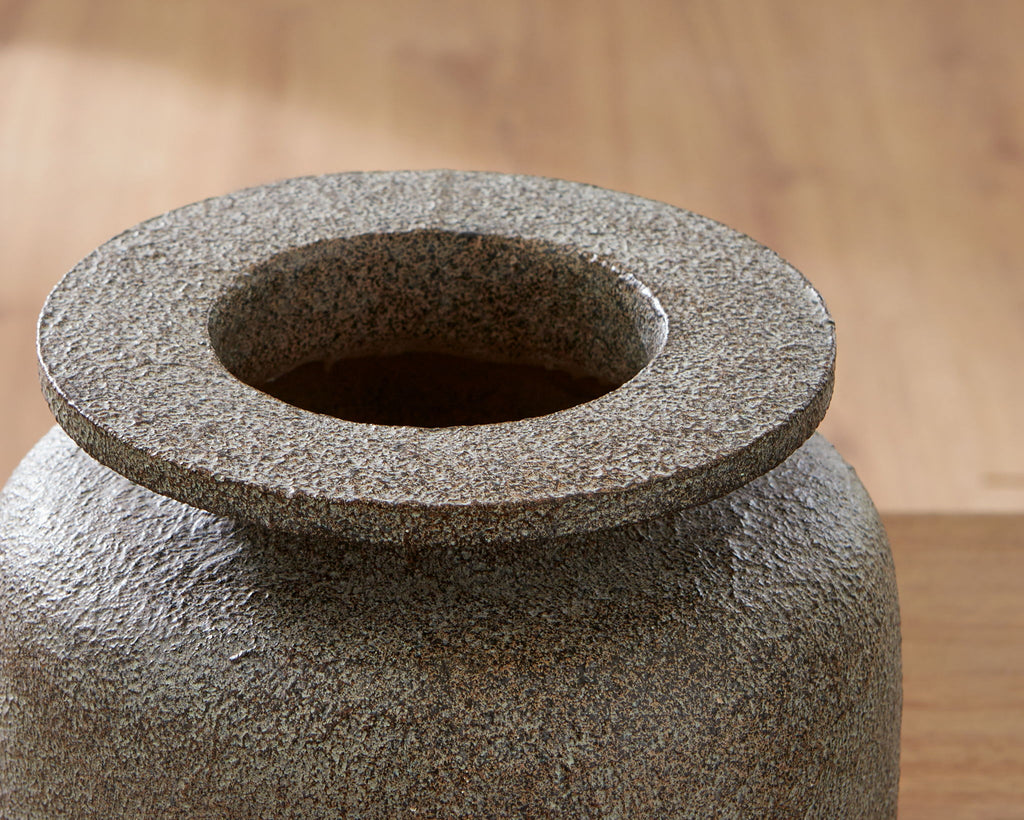 Gray textured vase top view with recessed center opening