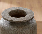 Gray textured vase top view with recessed center opening