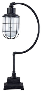Antique black metal desk lamp with curved arm and glass cage shade