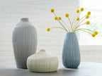 Set of 3 ribbed ceramic vases in gray, blue, and ivory, arranged on table