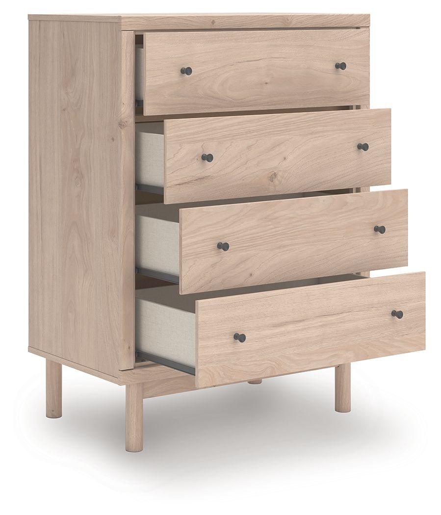 Four-drawer chest with drawers partially open, light tan wood and black knobs