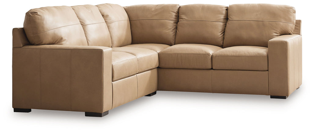 Light brown fabric sectional sofa with square arms and plush seat cushions