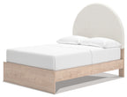 Beige upholstered panel bed with rounded arched headboard and white mattress