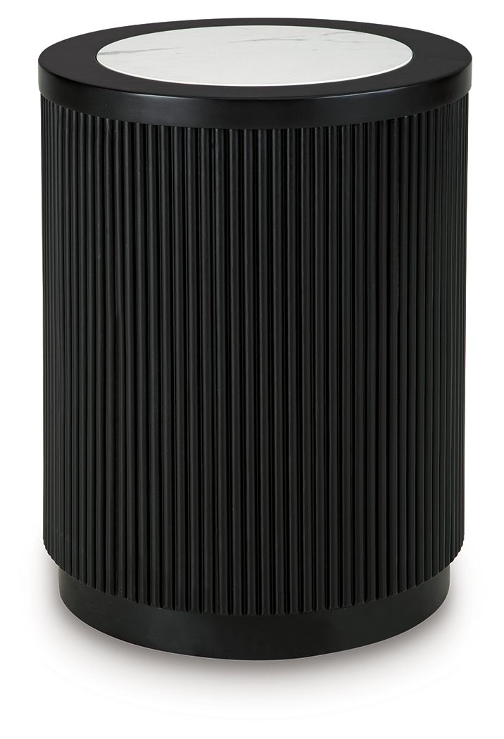Black ribbed round table with white marble-look top and dark outer rim