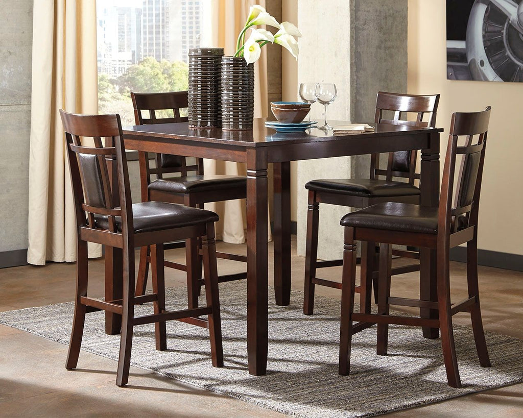 Brown counter-height dining table with four matching chairs