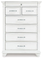 Whitewash dresser chest front with five drawers and metal bar pulls, turned feet