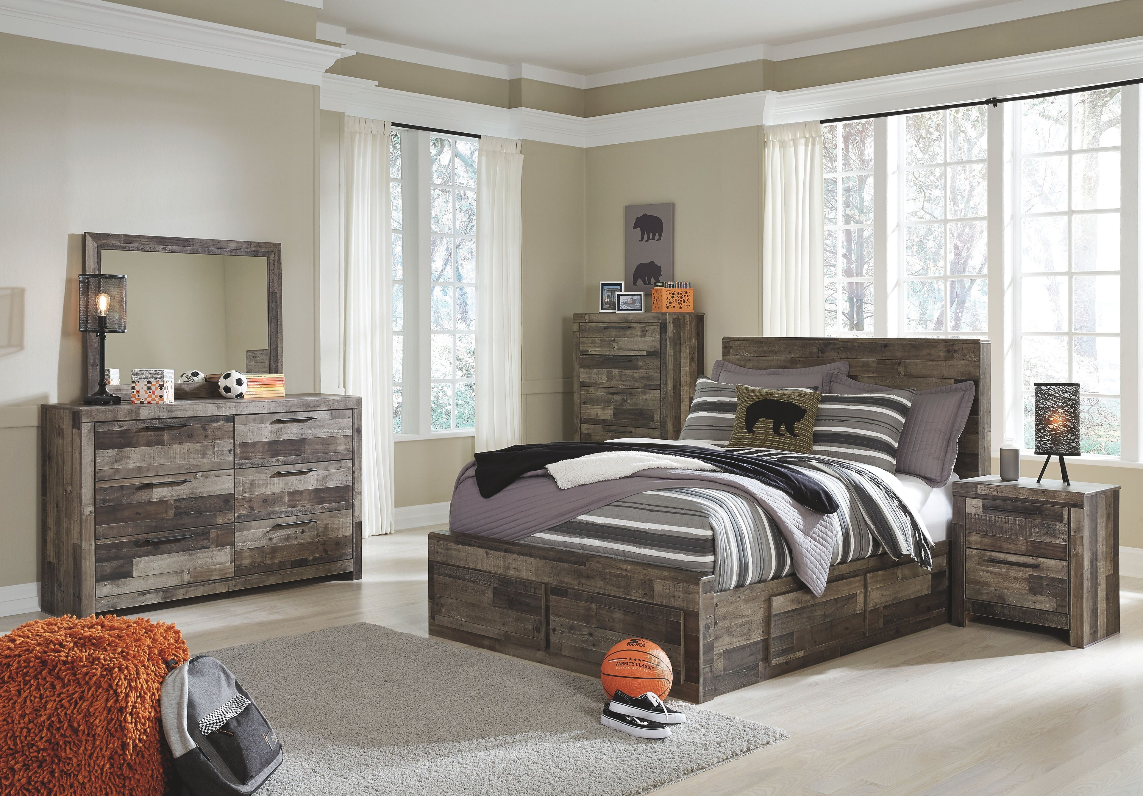 Youth panel bedroom set with dark wood bed, drawer dresser, and arched mirror