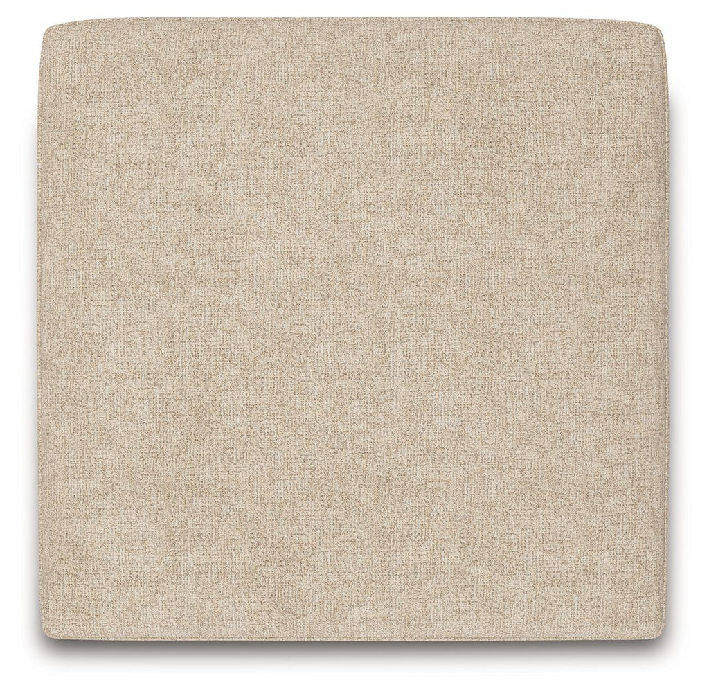 Sand square upholstered ottoman with textured side panel and dark legs