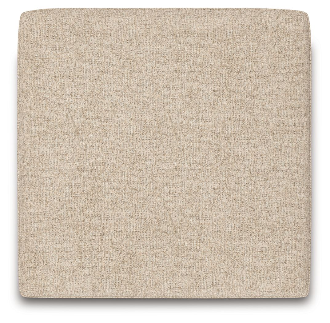 Sand square upholstered ottoman with textured side panel and dark legs