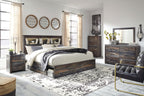Panel bookcase bed with side storage drawers, dark wood finish, white and striped bedding