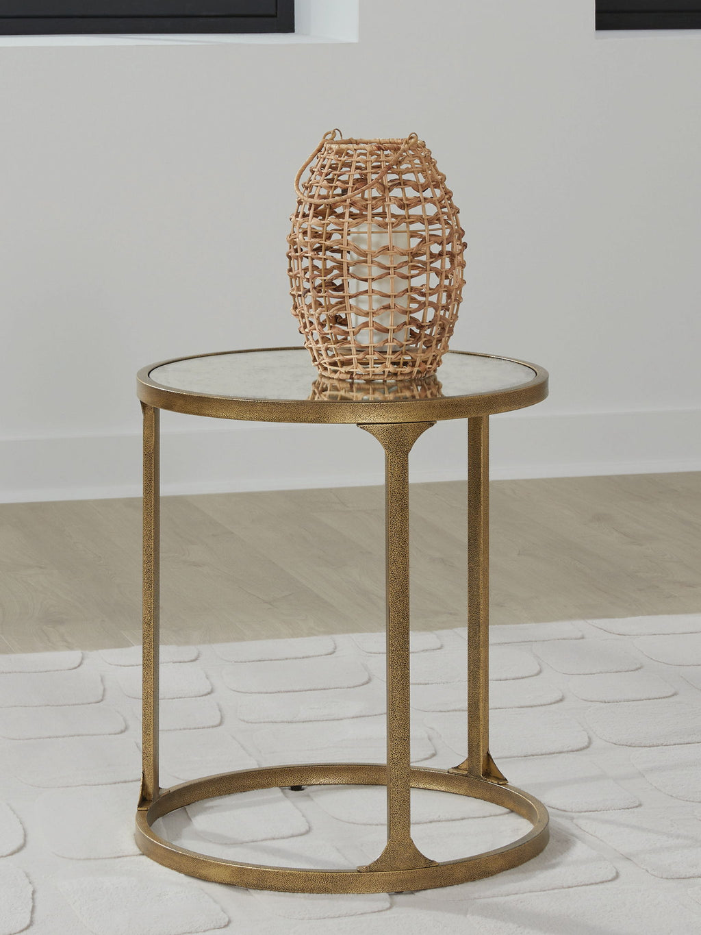 Round side table with light gray stone top, gold frame, and circular lower shelf