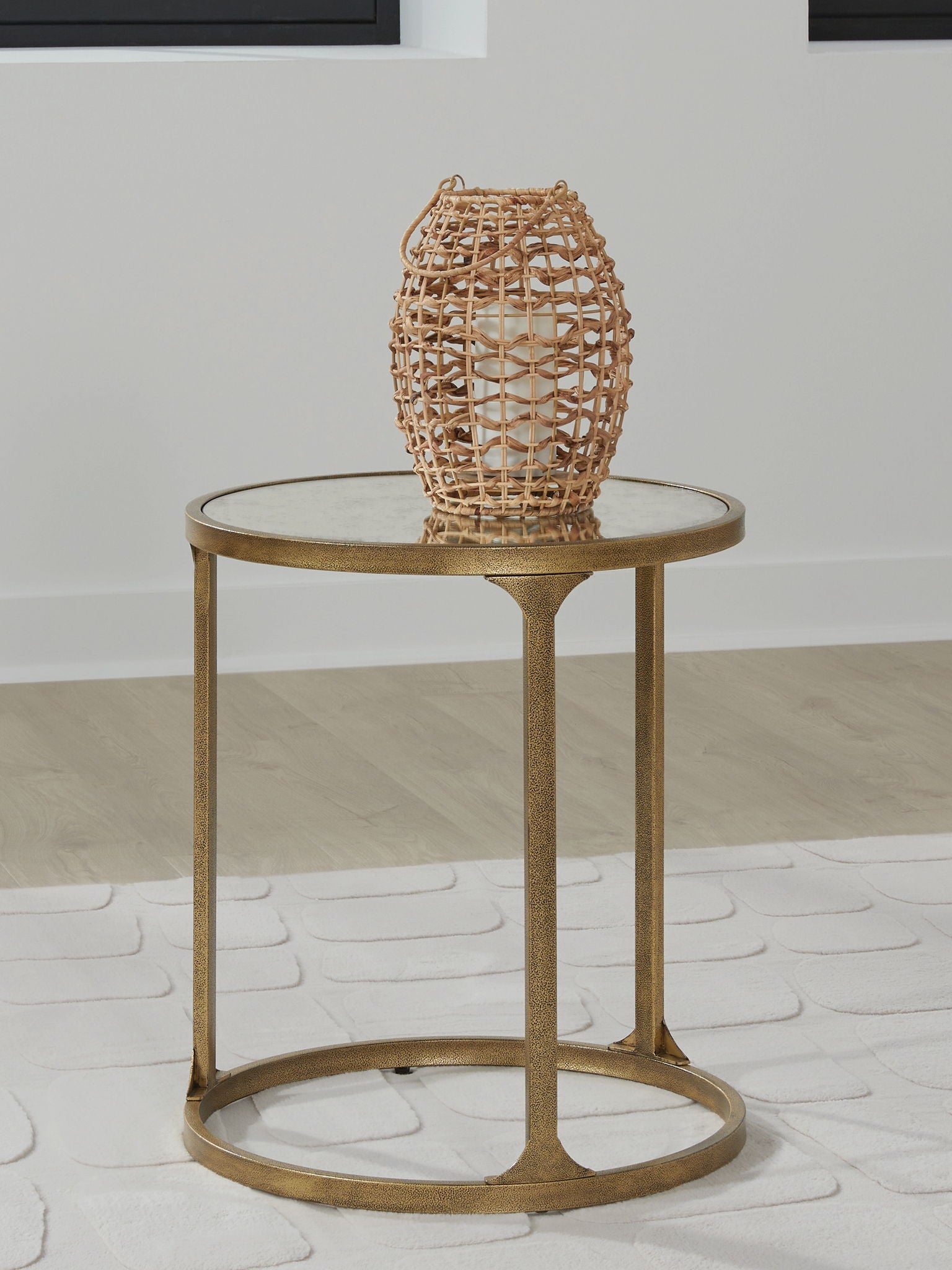 Round side table with light gray stone top, gold frame, and circular lower shelf