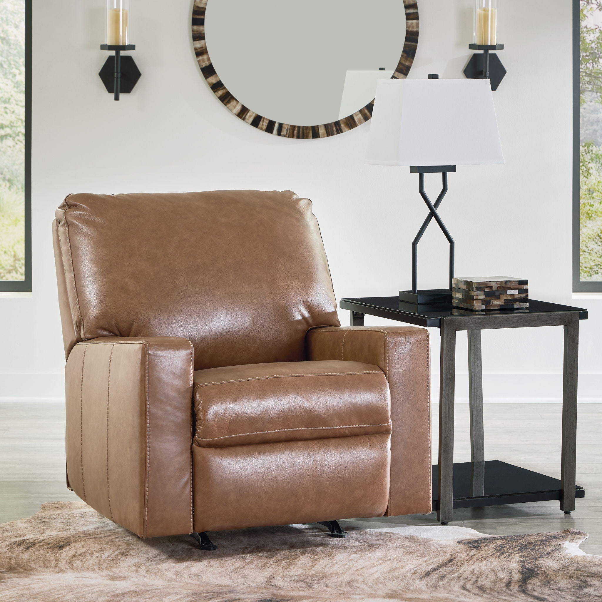 Caramel brown leather rocker recliner chair with square arms and padded back