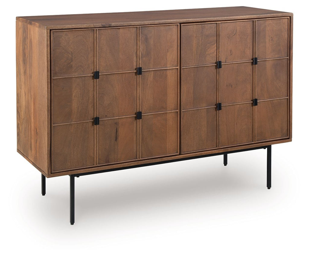 Brown accent cabinet with paneled doors and black metal knobs, raised on legs