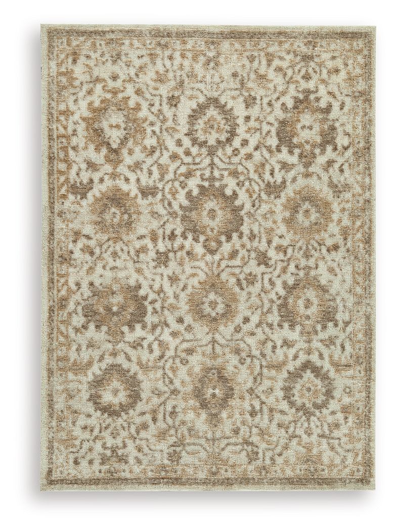 Light brown patterned area rug with ornate medallion motifs and border