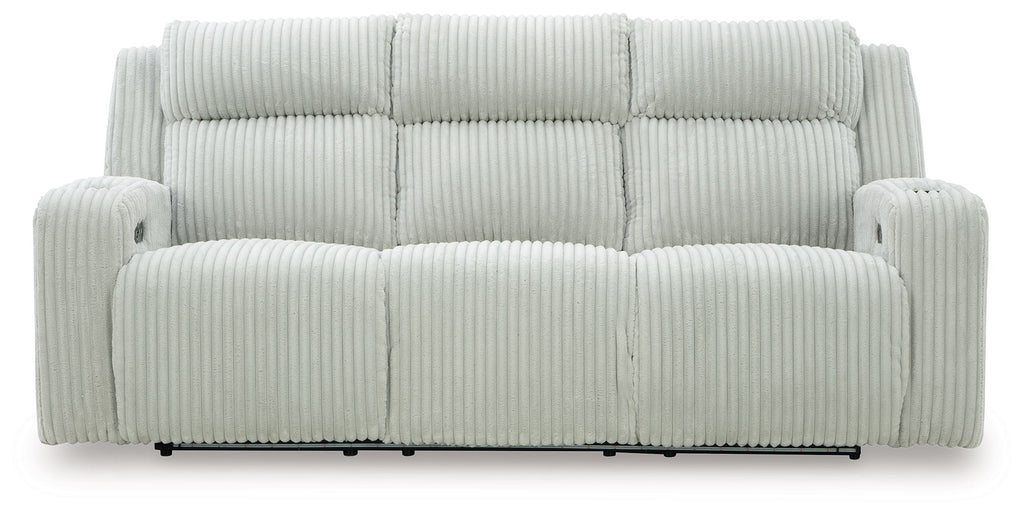 Power reclining sofa with adjustable headrests, light gray ribbed upholstery, front view