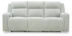 Power reclining sofa with adjustable headrests, light gray ribbed upholstery, front view