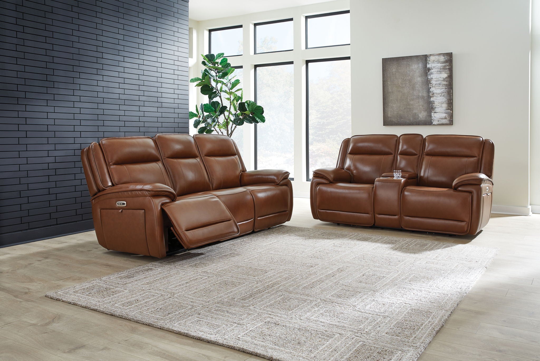 Dark brown leather power reclining sofa set with two recliners and padded headrests
