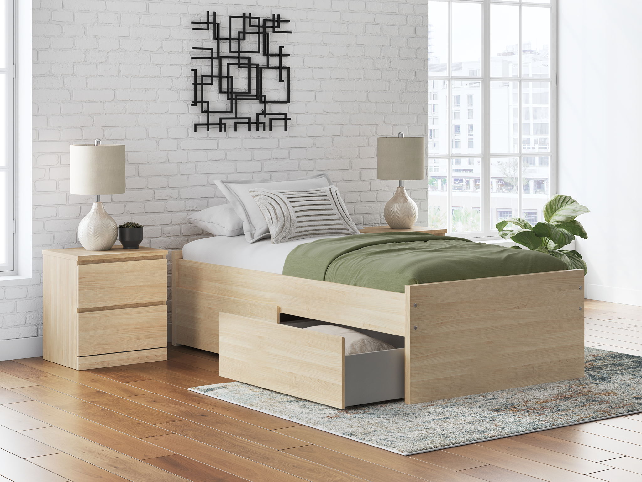 Light wood platform bed frame with slatted base, styled with green and white bedding