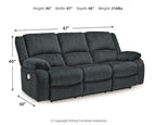 Draycoll reclining sofa in slate with tufted back, padded chaise seat, and rounded track arms