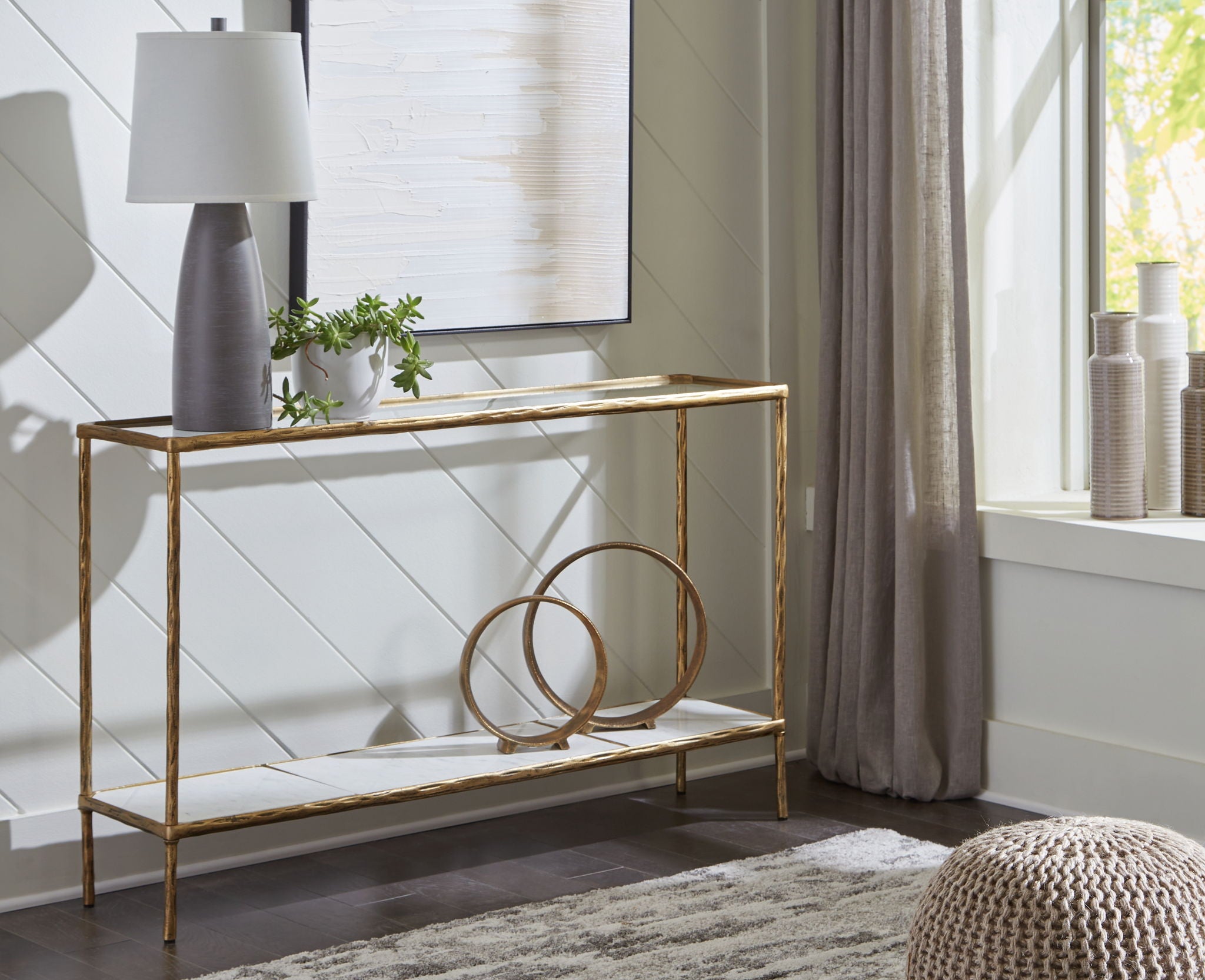 Antique brass console sofa table with two open shelves, slim metal frame