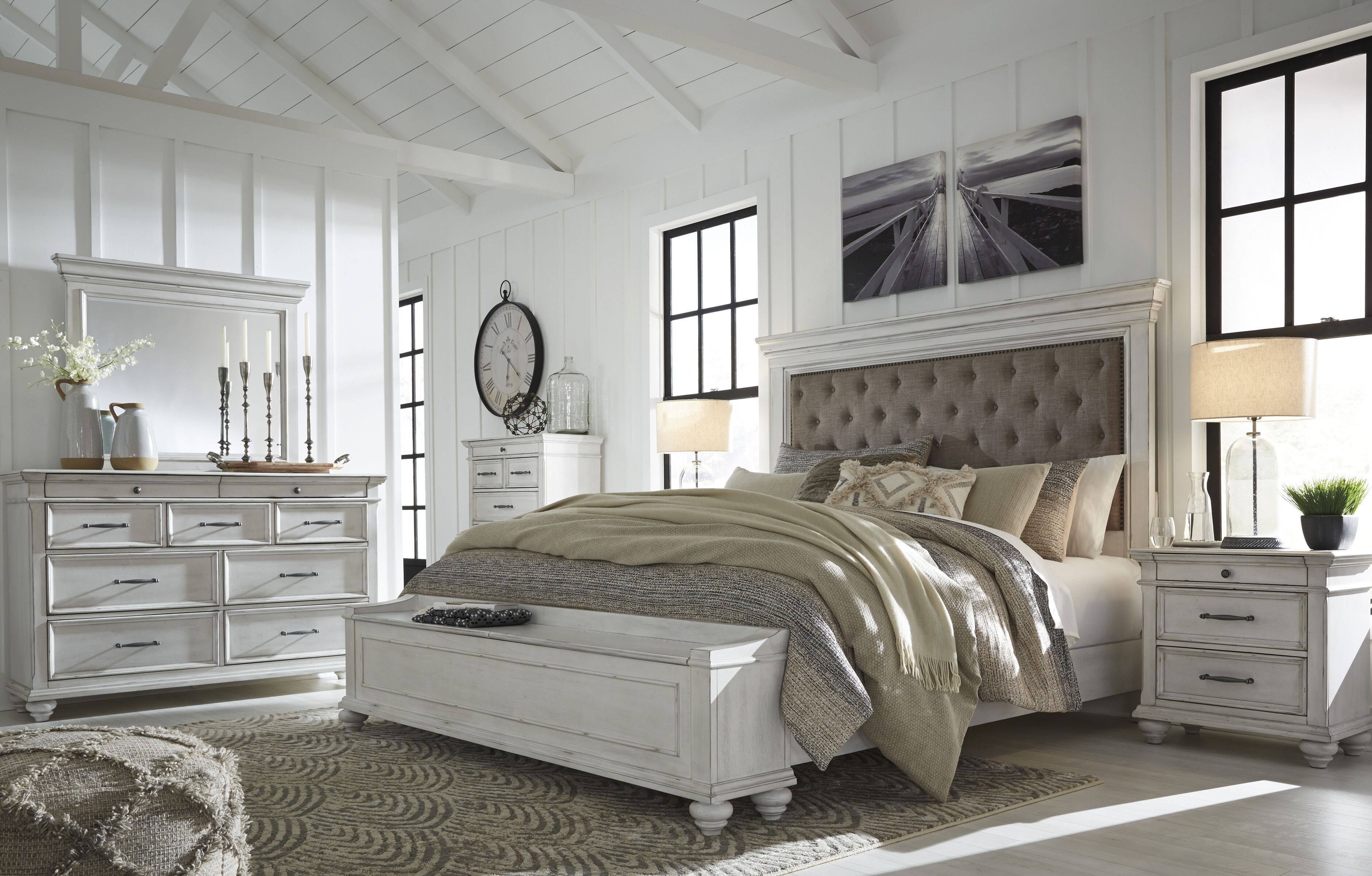 Kanwyn bedroom set with tufted upholstered headboard bed, dresser with mirror, and two nightstands