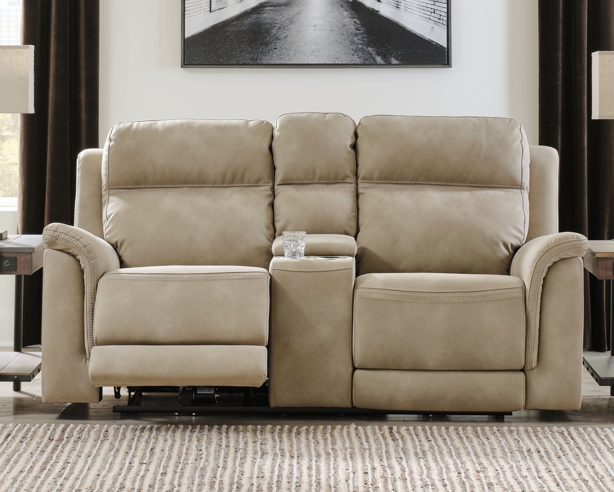 Beige reclining power loveseat with center console and plush cushioned arms
