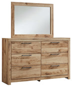 Tan wood dresser with attached mirror and six metal-pull drawers