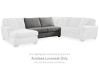 Gray armless loveseat with two seat cushions and three throw pillows