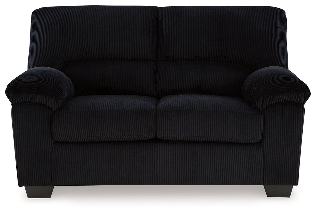 Upholstered loveseat, black fabric, tufted back cushions and padded armrests