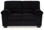 Upholstered loveseat, black fabric, tufted back cushions and padded armrests