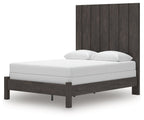 Fraluna dark gray panel bed with white mattress, two pillows, and thick headboard
