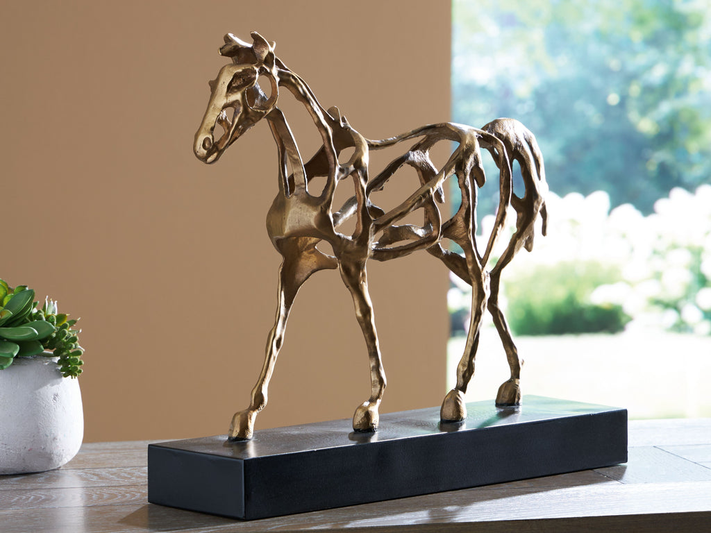 antique gold horse sculpture standing on dark rectangular base